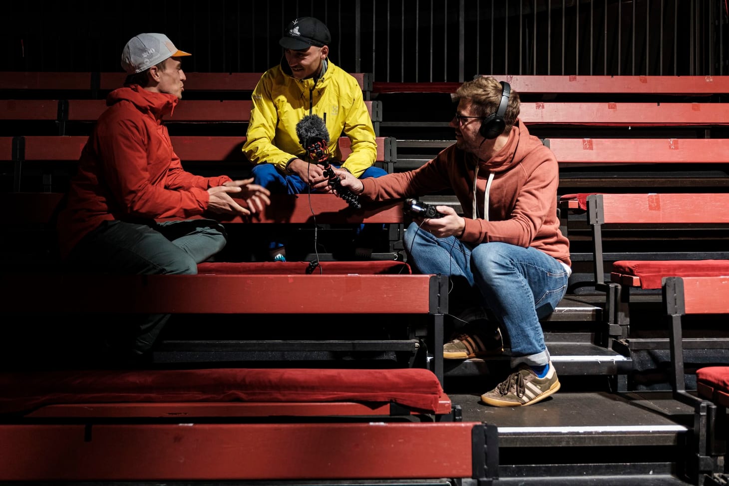 Iain Broome holding a microphone while Ross Brannigan interviews Tristan Janmart before the Trans Pyrenees race number 2. 